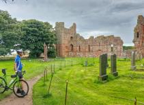 Cyclist at Holy Island Priory